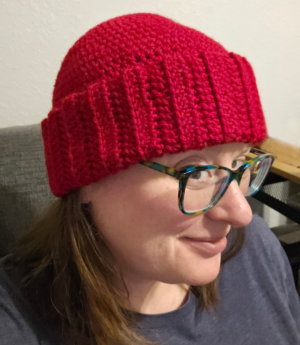 woman in red crochet hat